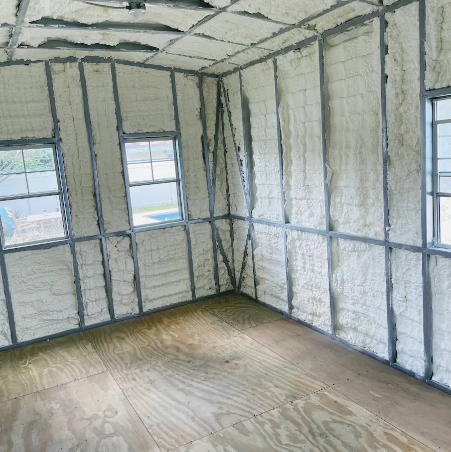 Closed-cell spray foam insulation applied to wall cavities in a residential project in Puyallup